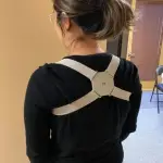 woman using Smart Posture Corrector